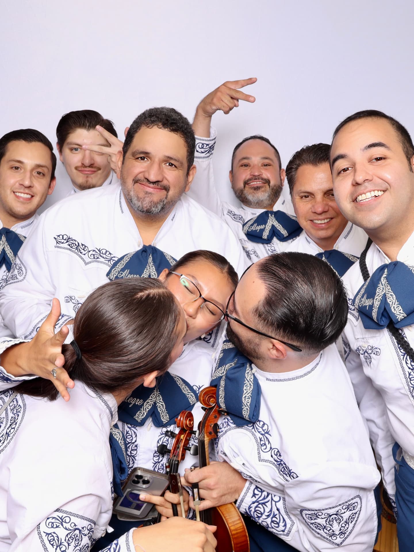 Mariachi Alegre musicians sharing a laugh together