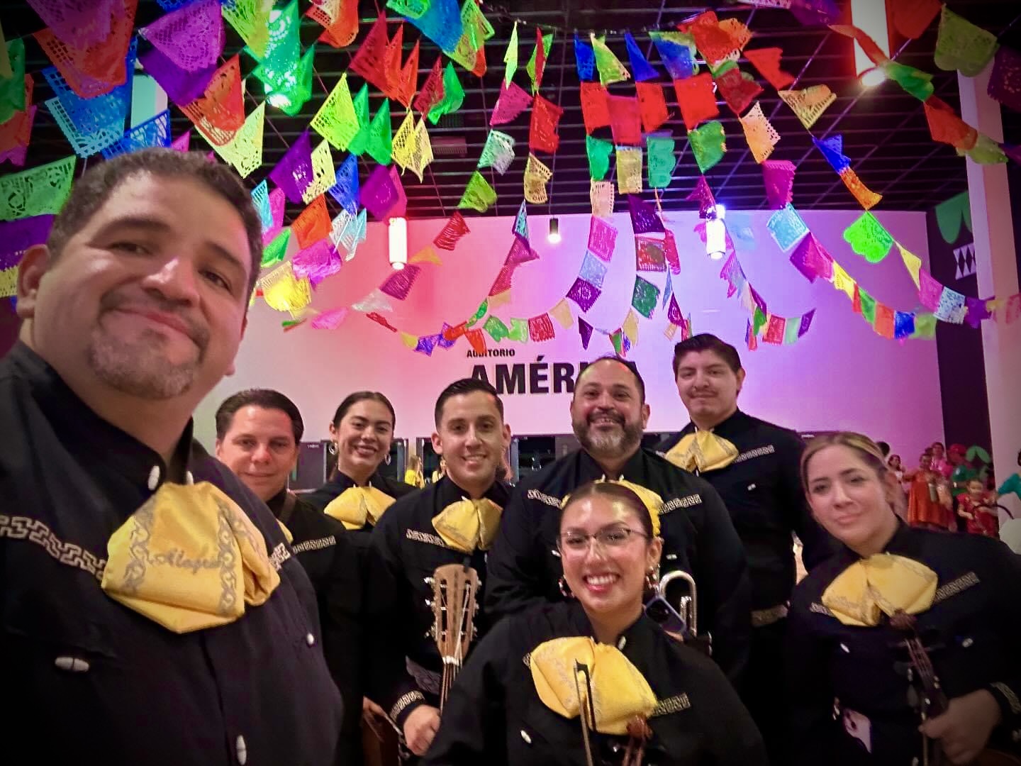 Mariachi Alegre under colorful papel picado banners